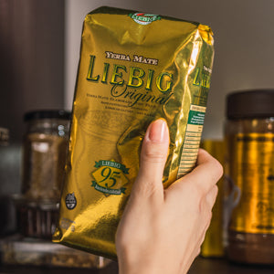 Close-up of Liebig Original yerba mate leaves showing 18-month aged blend with stems.